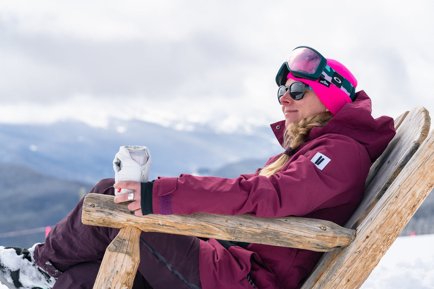 Woman Holding Cold Beer Can in Sleeve Outside