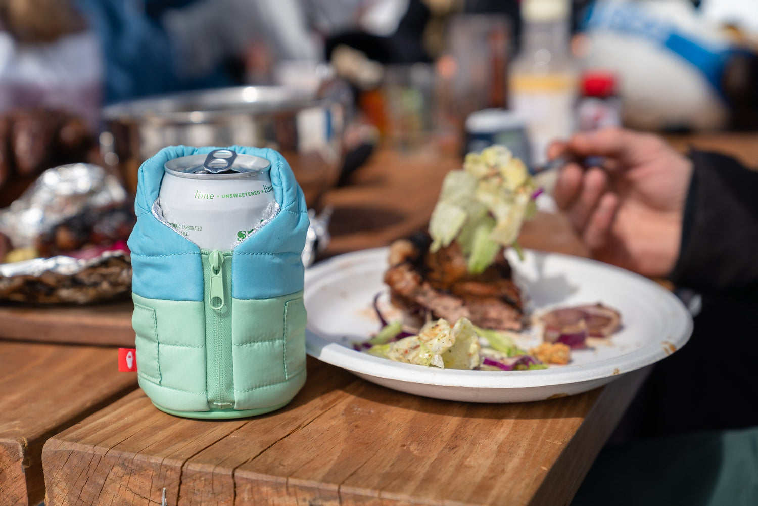 Beer in Can Sleeve On a Table