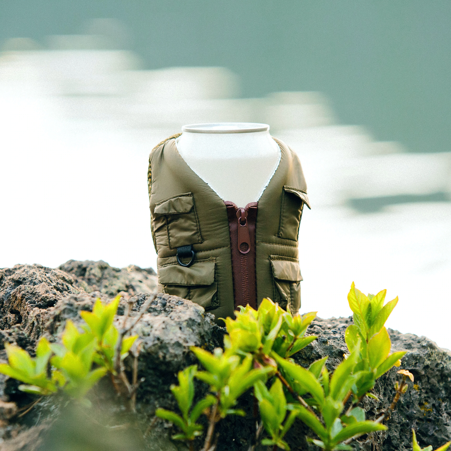 The Adventurer Green Ranger standing on a stone beside a lake 
